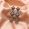 Oxidised Silver Stone Jhumka Earrings with Geometric Floral Design