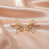 Gold Knot Bow Statement Earrings – Modern Sculptural Design