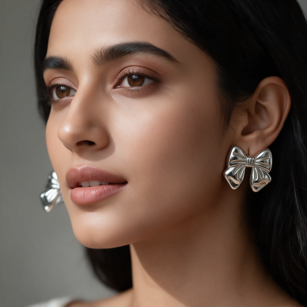 Silver Bow Statement Earrings