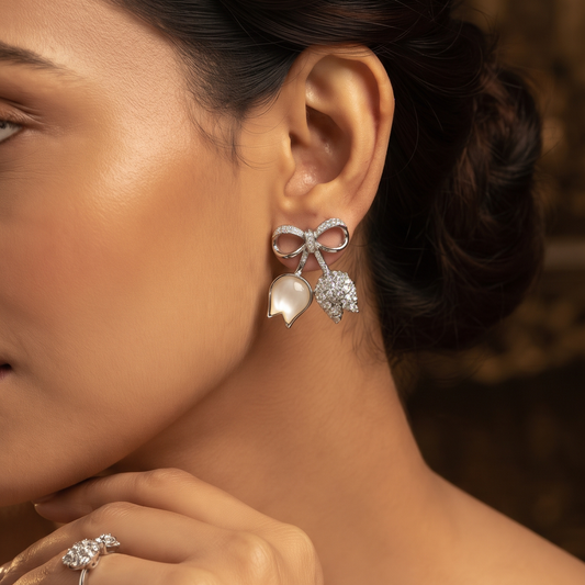 Elegant Silver-Tone Bow Earrings with Crystal & White Leaf Charms