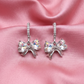 Crystal Bow Hoop Earrings – Gold & Silver