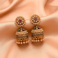 Antique Gold Pearl Studded Jhumka Earrings with Ruby & Green Stone Detailing