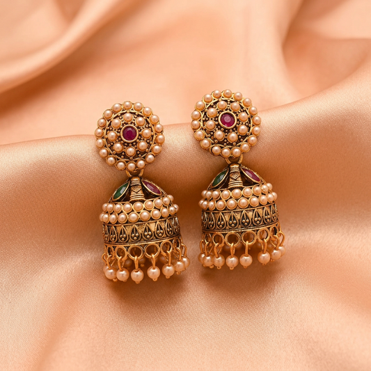 Antique Gold Pearl Studded Jhumka Earrings with Ruby & Green Stone Detailing
