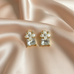Floral Crystal Drop Earrings – Elegant Gold Finish Statement Design