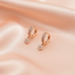 Crystal Huggie Earrings with Floral Charm for Women – Elegant Gold Drop Design- American Diamond