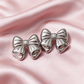 Silver Bow Statement Earrings
