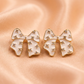 White Bow Statement Stud Earrings
